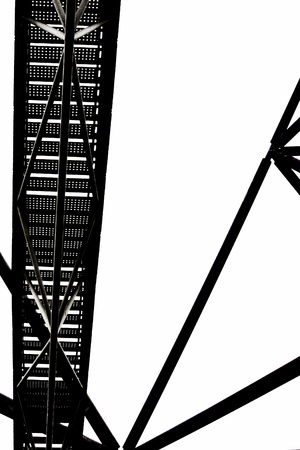 Vertical black and white photo of the staircase and steel construction of Tetrahedron in Bottrop, Germany taken from below against the sky. The popular landmark on a mine dump serves as a view point.の写真素材
