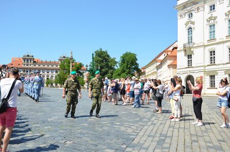 Prague, Czech Republic - June 27th 2019: Tourists watching traditional changing of honor guards in front of the Prague Castle. Prague Castle Guard. Crowd of people. Tourist attraction.のeditorial素材