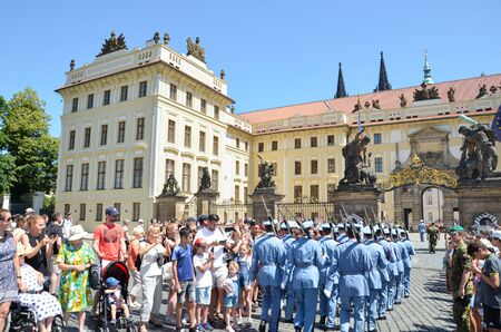 Prague, Czech Republic - June 27th 2019: Tourists watching traditional changing of honor guards in front of the Prague Castle. Prague Castle Guard. Crowd of people. Tourist attraction.のeditorial素材