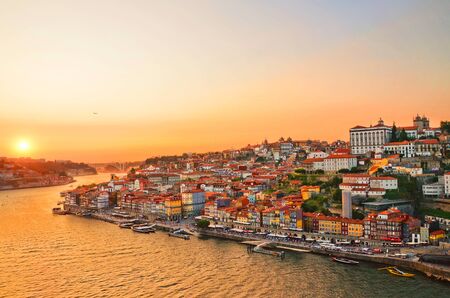 Magnificent sunset over the Porto city center and the Douro river, Portugal. Dom Luis I Bridge is a popular tourist spot as it offers such a beautiful view over the area.の写真素材