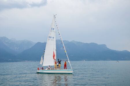 Vevey, Switzerland - July 26 2019: People on sailboats celebrate Fete des Vignerons 2019. Traditional festival pays homage to viticultural traditions in Lavaux wine region. Organized once in 20-25 years, since 18th century. It was honoured as the first liのeditorial素材