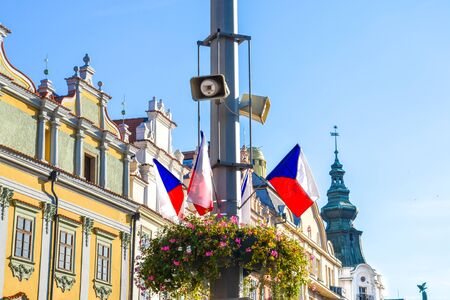 Small Czech flags waving on the street during the national holiday celebration. Historical buildings in the background. Czech Republic democracy and freedom concept. Bohemia, Moravia, and Silesia.の写真素材