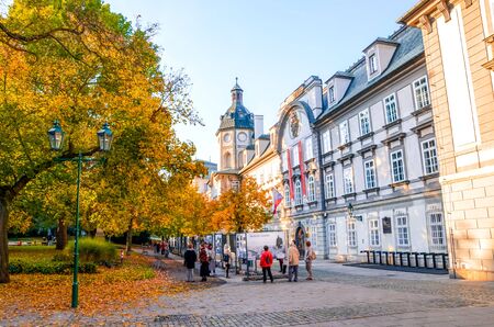 Pilsen, Czechia - Oct 28, 2019: Smetanovy sady in Plzen, Czech Republic. Outside exhibition in front of the library building. People on the streets. Fall trees. Old town of the historical city.のeditorial素材