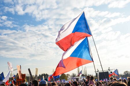Prague, Czech Republic - Nov 16, 2019: Crowd protests against Prime Minister Babis and Minister of Justice on Letna, Letenska plan. The 30th anniversary of the fall of communism, waving Czech flags.のeditorial素材