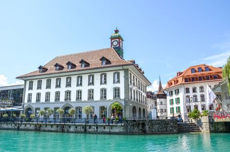 Thun, Switzerland - August 8, 2019: Beautiful cityscape of the Swiss city. Medieval houses located...