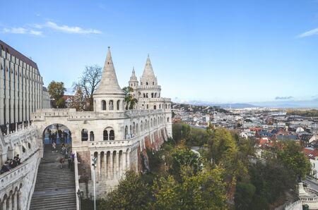 Budapest, Hungary - Nov 6, 2019: Fishermans Bastion in the Hungarian capital. One of the most popular monuments in town, built in Neo-Romanesque style. Tourists sightseeing. City in the background.のeditorial素材