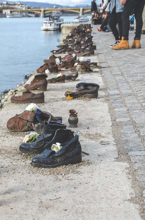 Budapest, Hungary - Nov 6, 2019: Iron Shoes on the Danube Bank. Monument to honour the Jews who were...