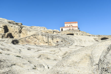 The Uplistsikhe cave complex near Gori, Georgia. Ancient rock-hewn town and three-nave basilica in eastern Georgia. Georgian gourist landmarkの写真素材