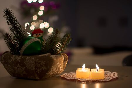 Christmas decoration  with lights bokeh and candles. Greeting card for new year party. Festive holidayの写真素材