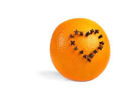 Heart of cloves on the orangeの写真素材