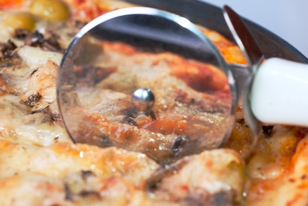 a pizza and roll-knife