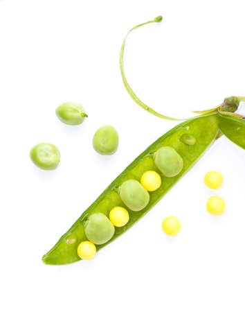 green peas and vitamin  isolated on a white backgroundの写真素材