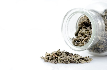 heap of tea and glass bottleの写真素材