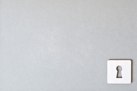 a key and paper keyholeの写真素材