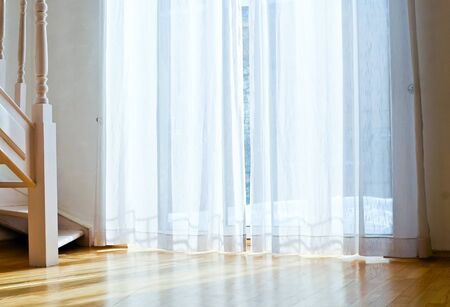 windows with curtain and wooden floorの写真素材