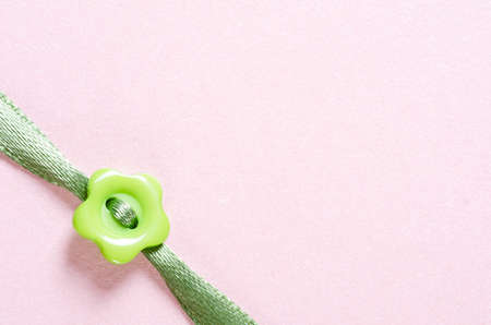 texture paper and ribbon with flower button and copy spaceの写真素材