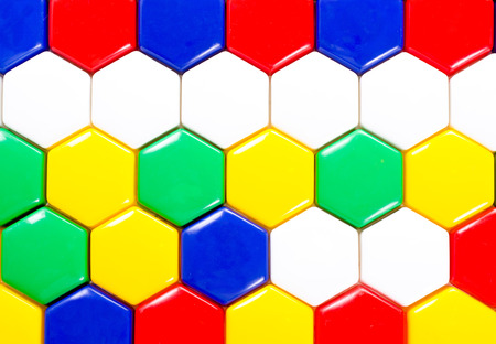 a background from multicolored plastic mosaic toyの写真素材