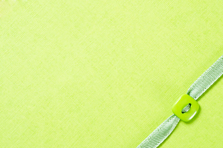 texture paper and ribbon with flower button and copy spaceの写真素材