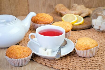 sweet muffins on wooden tableの写真素材