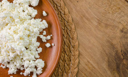 curds on the brown plateの写真素材