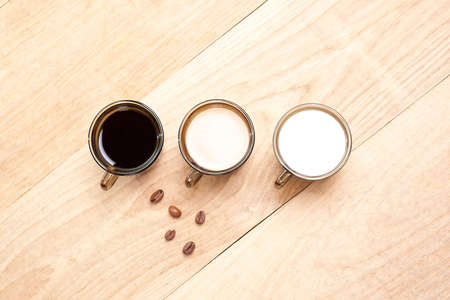 cup with coffee, milk and cocoa