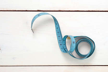 twisted tape measure on white backgroundの写真素材