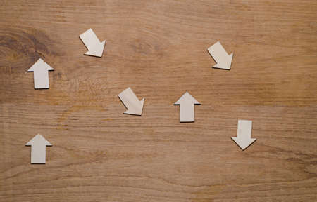 wood derection arrow with tag on wood backgroundの写真素材