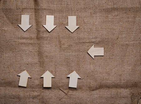 wood derection arrow with tag on sack backgroundの写真素材