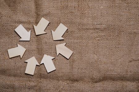 wood derection arrow with tag on sack backgroundの写真素材