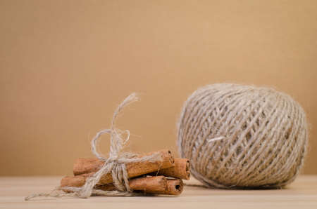 a group of cinnamon on the wood board,の写真素材