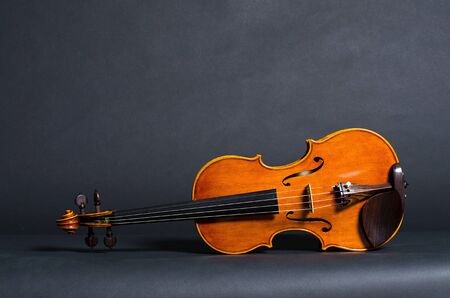 view of old wooden violin on black backgroundの写真素材