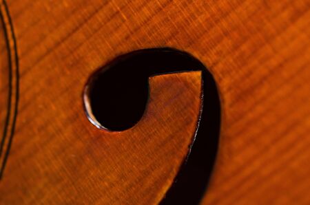 wooden violin part on black background, macroの写真素材