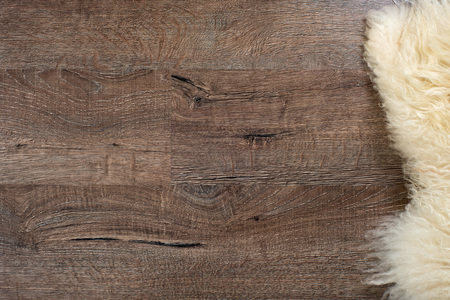 Decorative fur carpet on wood floor backgroundの写真素材