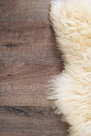 Decorative fur carpet on wood floor backgroundの写真素材