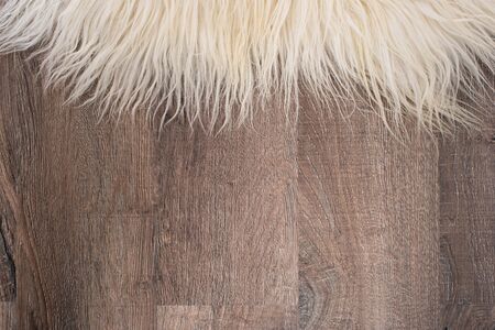 Decorative fur carpet on wood floor backgroundの写真素材