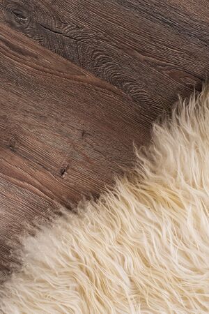 Decorative fur carpet on wood floor backgroundの写真素材