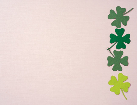 St. Patrick's Day shamrocks on paper backgroundの写真素材