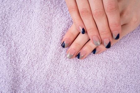 a woman in salon making nail manicureの写真素材