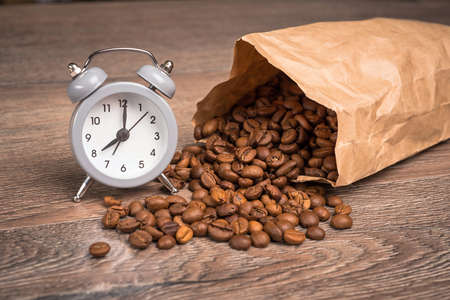a spilled black coffee bag in spotlight