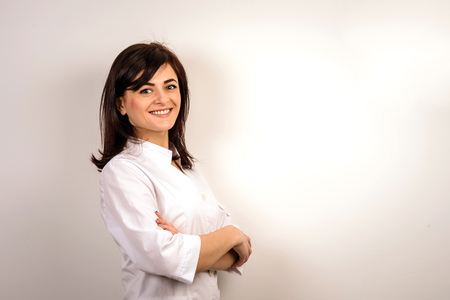 Smiling medical doctor woman.  Pretty girl in uniformの写真素材