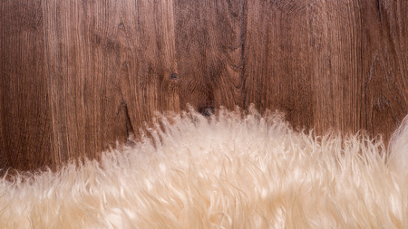 Decorative fur carpet on wood floor backgroundの写真素材