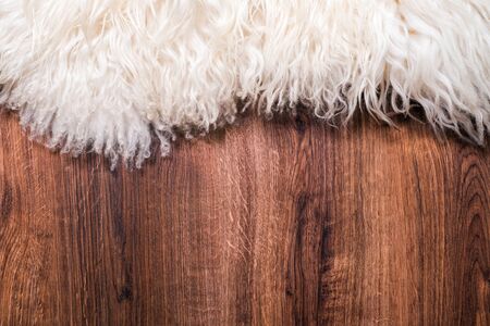 Decorative fur carpet on wood floor backgroundの写真素材