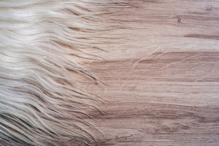 Decorative fur carpet on wood floor backgroundの写真素材