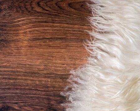 Decorative fur carpet on wood floor backgroundの写真素材