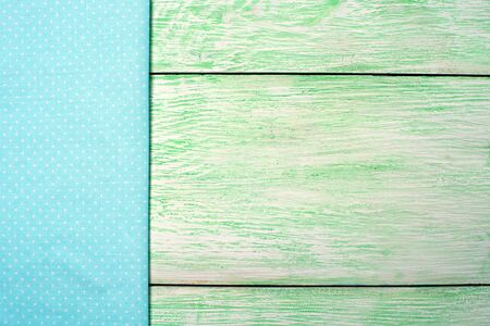 Tablecloth blue textile on wooden green background