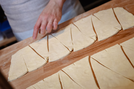 baker concept. Make wheat croissant on wooden table , fresh bakeryの写真素材