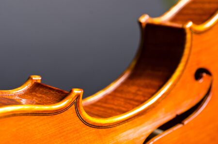 wooden violin part on black background, macroの写真素材
