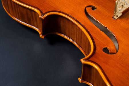 wooden violin part on black background, macroの写真素材
