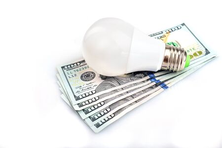 Light bulb with dollar on white backgroundの写真素材