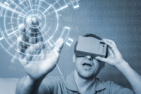Concept of virtual reality carton glasses and interfaces. man enjoying vr glasses.の写真素材
